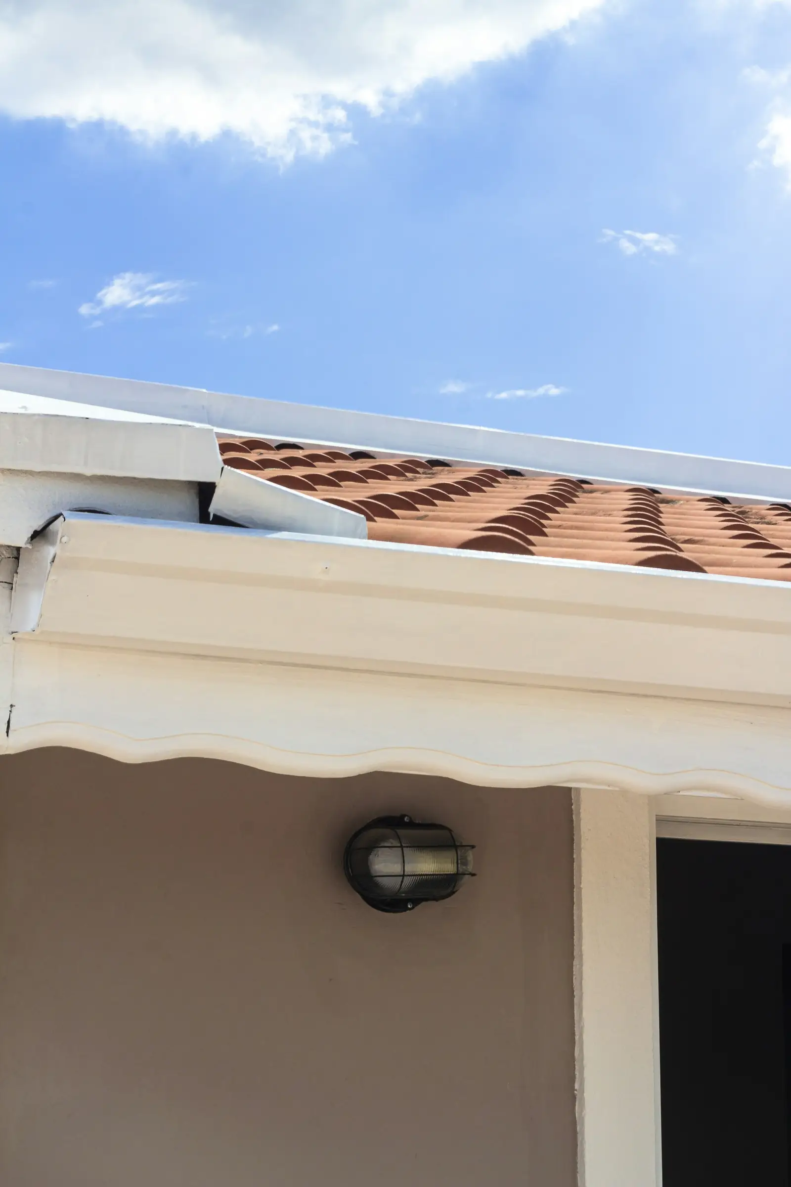 The tile edge and gutter of a white house